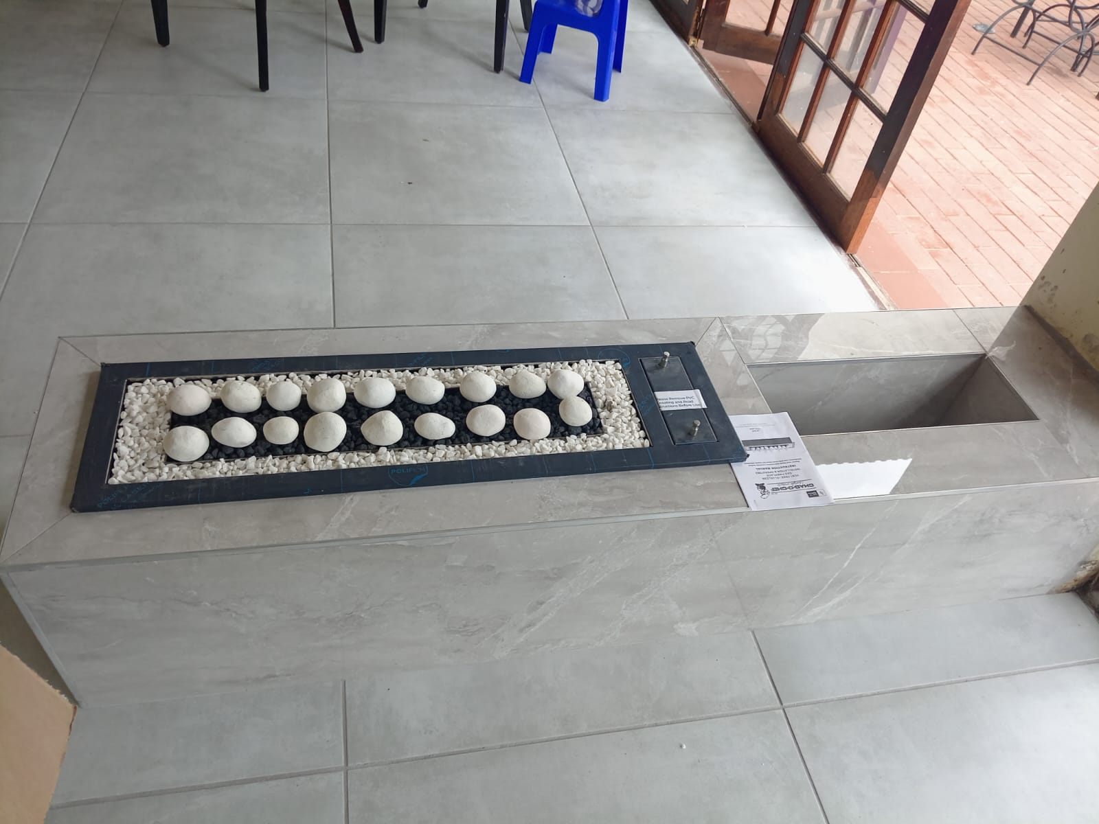 Indoor pebble fire pit