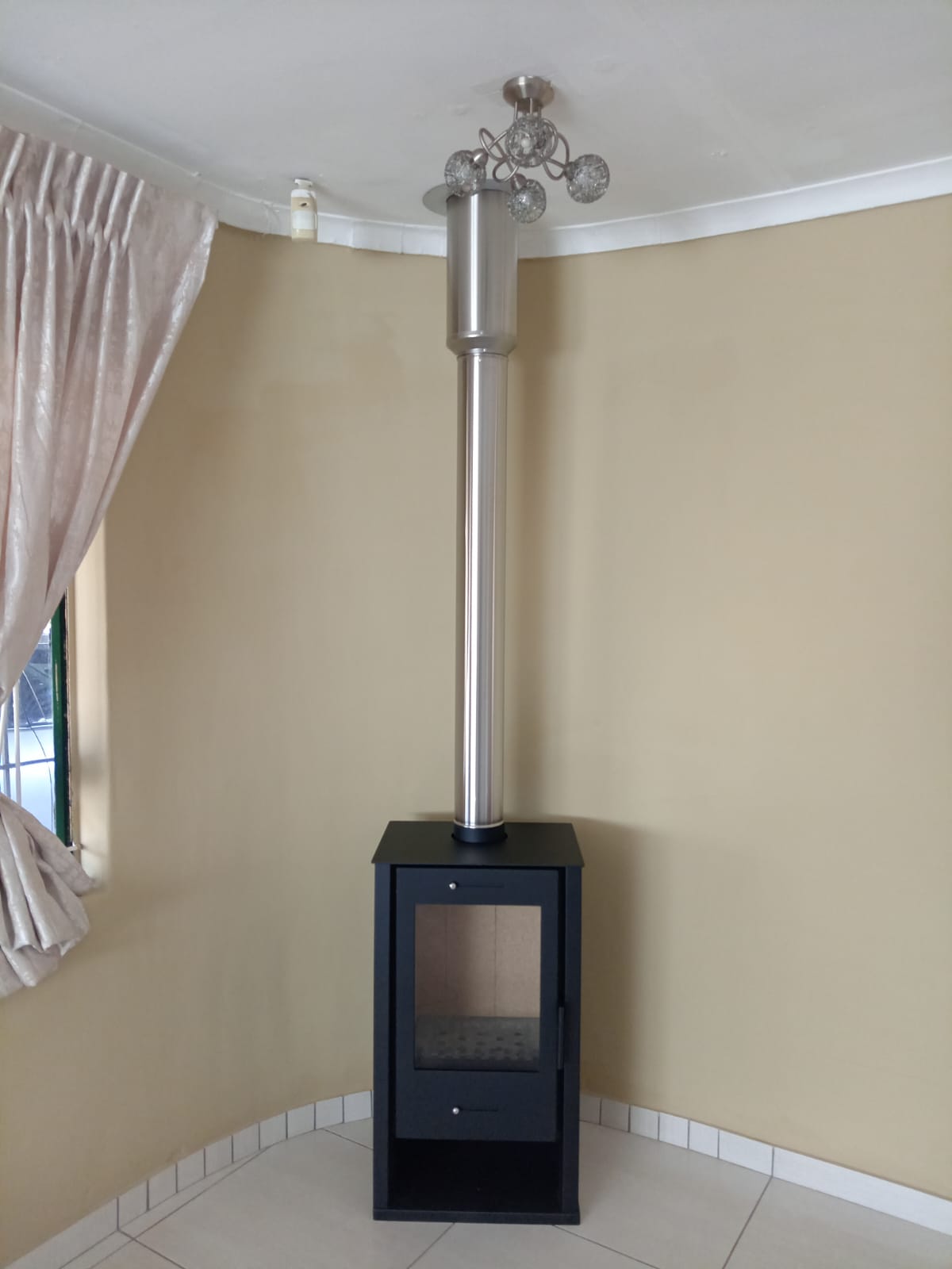 Corner stove with flue