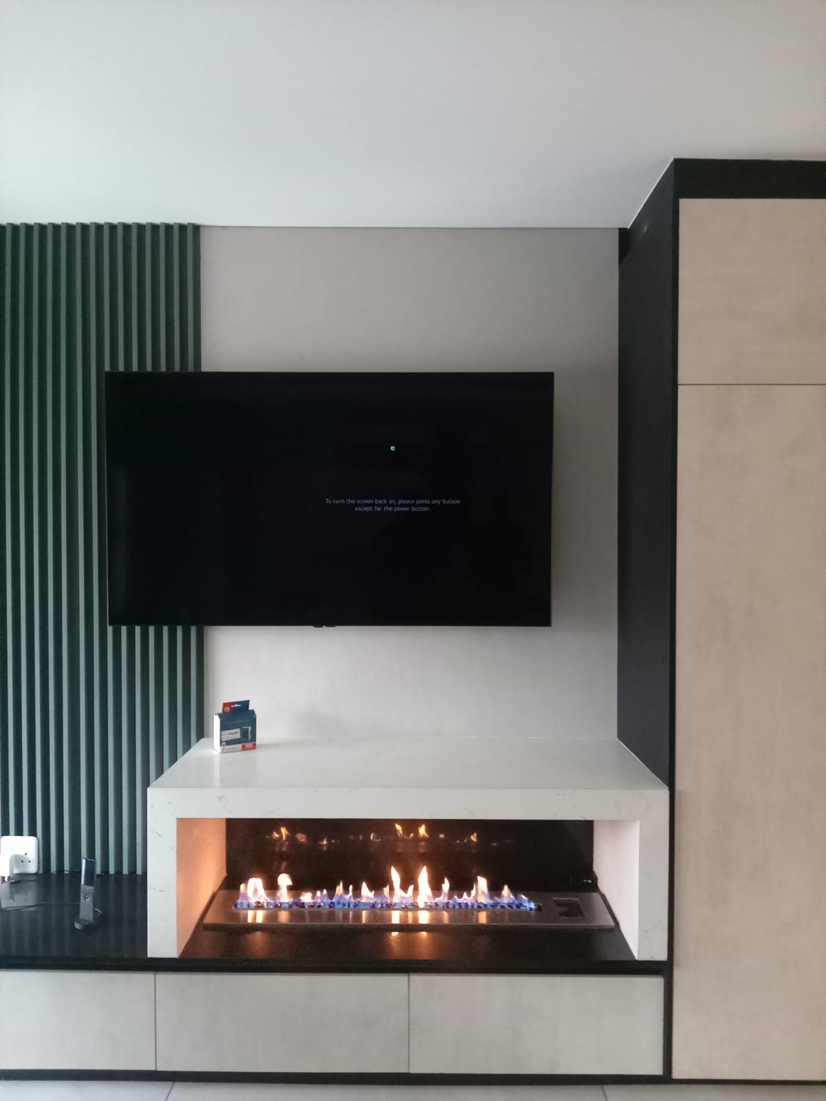 Linear gas fireplace under TV